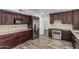 Well-equipped kitchen with stainless steel appliances, granite countertops, and wooden cabinets at 1847 W Leah Ln, Gilbert, AZ 85233