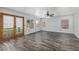 Bright and airy living room boasting wood-look tile flooring and a ceiling fan at 1847 W Leah Ln, Gilbert, AZ 85233