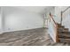 Spacious living room featuring wood-look tile flooring and abundant natural light at 1847 W Leah Ln, Gilbert, AZ 85233