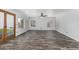Bright and airy living room boasting wood-look tile flooring and a ceiling fan at 1847 W Leah Ln, Gilbert, AZ 85233