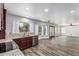 This living room has beautiful wood-look floors and large windows to let in natural light at 1847 W Leah Ln, Gilbert, AZ 85233