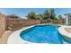 Beautifully designed swimming pool with a curved edge, perfect for cooling off on hot days at 1847 W Leah Ln, Gilbert, AZ 85233
