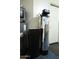 The utility room features a Ruud water heater and an Envirotec water softening system for modern home convenience at 1847 W Leah Ln, Gilbert, AZ 85233