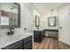Bathroom with dual sinks, vanity with accent lighting and storage at 18820 N 33Rd Ave, Phoenix, AZ 85027