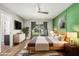 Comfortable bedroom featuring modern decor and a sliding glass door to the backyard at 18820 N 33Rd Ave, Phoenix, AZ 85027