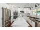 Beautiful kitchen with stainless steel appliances, island, and dark countertops with white subway tile backsplash at 18820 N 33Rd Ave, Phoenix, AZ 85027