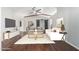 Beautiful open living room with hardwood floors, vaulted ceilings, and barn doors at 18820 N 33Rd Ave, Phoenix, AZ 85027