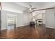 Bright living room boasts hardwood floors, a vaulted ceiling, and a cozy fireplace, creating a warm and inviting space at 18820 N 33Rd Ave, Phoenix, AZ 85027