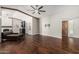 Spacious living area featuring beautiful wood floors, a stylish bar area, and ample natural light at 18820 N 33Rd Ave, Phoenix, AZ 85027