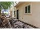 Exterior view of back patio and door, small garden area, and fence at 2000 N 36Th St # 17, Phoenix, AZ 85008
