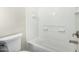 Bright bathroom features white tiled walls and a white bathtub at 2000 N 36Th St # 17, Phoenix, AZ 85008