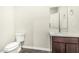 Clean bathroom featuring a toilet and single sink vanity with a mirror above at 2000 N 36Th St # 17, Phoenix, AZ 85008