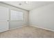 Well-lit bedroom featuring plush carpeting and a window at 2000 N 36Th St # 17, Phoenix, AZ 85008