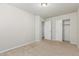 Bedroom with carpet, closet, and two entrance doors at 2000 N 36Th St # 17, Phoenix, AZ 85008