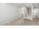 Hallway with neutral paint, carpet, and access to multiple rooms through white doors at 2000 N 36Th St # 17, Phoenix, AZ 85008
