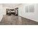 Modern kitchen featuring dark wood cabinetry, stainless steel appliances, and an island with pendant lighting at 2000 N 36Th St # 17, Phoenix, AZ 85008