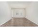 A bright living room with neutral walls, tiled floors, and bright white trim at 2000 N 36Th St # 17, Phoenix, AZ 85008