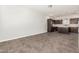 Open-concept living area showing dark wood kitchen cabinets and a kitchen island with stainless steel appliances at 2000 N 36Th St # 17, Phoenix, AZ 85008
