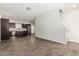 Spacious living area open to a modern kitchen with stainless steel appliances and dark wood cabinetry at 2000 N 36Th St # 17, Phoenix, AZ 85008