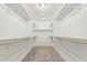 Spacious walk-in closet with adjustable shelving and carpeted floor at 2000 N 36Th St # 17, Phoenix, AZ 85008