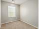 Bedroom with carpet and window with blinds at 2000 N 36Th St # 20, Phoenix, AZ 85008