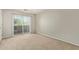 Bedroom with patio door and fan at 2000 N 36Th St # 20, Phoenix, AZ 85008