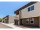 Modern townhome with stacked stone accents, a balcony, and neutral color scheme at 2000 N 36Th St # 20, Phoenix, AZ 85008