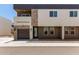 Modern townhome featuring stacked stone accents, a garage, and neutral color scheme at 2000 N 36Th St # 20, Phoenix, AZ 85008