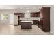 Modern kitchen with island, dark wood cabinets, and stainless steel appliances at 2000 N 36Th St # 20, Phoenix, AZ 85008
