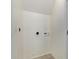 A blank laundry room with white walls and tile flooring, ready for customization at 2000 N 36Th St # 20, Phoenix, AZ 85008