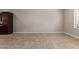 Spacious living room with tile flooring, baseboards, and natural light at 2000 N 36Th St # 20, Phoenix, AZ 85008