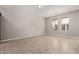 A bright living room with tile floors and natural light from two windows at 2000 N 36Th St # 20, Phoenix, AZ 85008