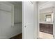 A walk-in closet with shelving and carpeted floor, located near a hallway and a bathroom at 2000 N 36Th St # 20, Phoenix, AZ 85008