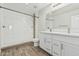 Modern bathroom features dual sinks, white tile, and a walk-in shower at 2000 N 36Th St # 35, Phoenix, AZ 85008