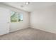 Bright bedroom has a large window with views of trees and a convenient closet at 2000 N 36Th St # 35, Phoenix, AZ 85008