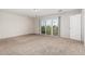Spacious bedroom with carpet, glass sliding doors, and natural light at 2000 N 36Th St # 35, Phoenix, AZ 85008