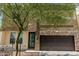 Stylish two-story home featuring stone accents and a two-car garage at 2000 N 36Th St # 35, Phoenix, AZ 85008