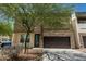 Charming home featuring stone accents, a well-manicured front yard, and a two-car garage at 2000 N 36Th St # 35, Phoenix, AZ 85008