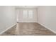 Bright living room featuring hardwood floors and a glass door at 2000 N 36Th St # 35, Phoenix, AZ 85008