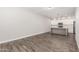 Open concept living space with hardwood floors and a partial kitchen view at 2000 N 36Th St # 35, Phoenix, AZ 85008