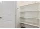 Walk-in pantry with white shelving at 2000 N 36Th St # 35, Phoenix, AZ 85008