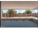 View of enclosed back porch with concrete flooring and backyard views at 2331 E Delgado St, Phoenix, AZ 85022