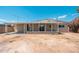 Backyard view of covered patio, siding, and brick details on a sunny day at 2331 E Delgado St, Phoenix, AZ 85022