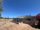 Exterior view of a home with an enclosed patio and spacious backyard, perfect for outdoor living at 2331 E Delgado St, Phoenix, AZ 85022