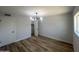 A view of the bedroom with a closet and wood floors at 2331 E Delgado St, Phoenix, AZ 85022