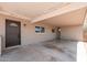 View of home's carport showing front door and ample parking space at 2331 E Delgado St, Phoenix, AZ 85022