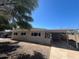 Street view of a single-story home featuring a carport and well-maintained landscaping at 2331 E Delgado St, Phoenix, AZ 85022