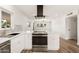Bright and modern kitchen boasts white cabinets and stainless steel appliances at 2331 E Delgado St, Phoenix, AZ 85022