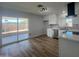 Open kitchen with stainless appliances, white cabinets, and direct access to the outdoor patio at 2331 E Delgado St, Phoenix, AZ 85022