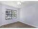 Cozy bedroom with large window offering neighborhood views at 2333 E Southern Ave # 1015, Tempe, AZ 85282